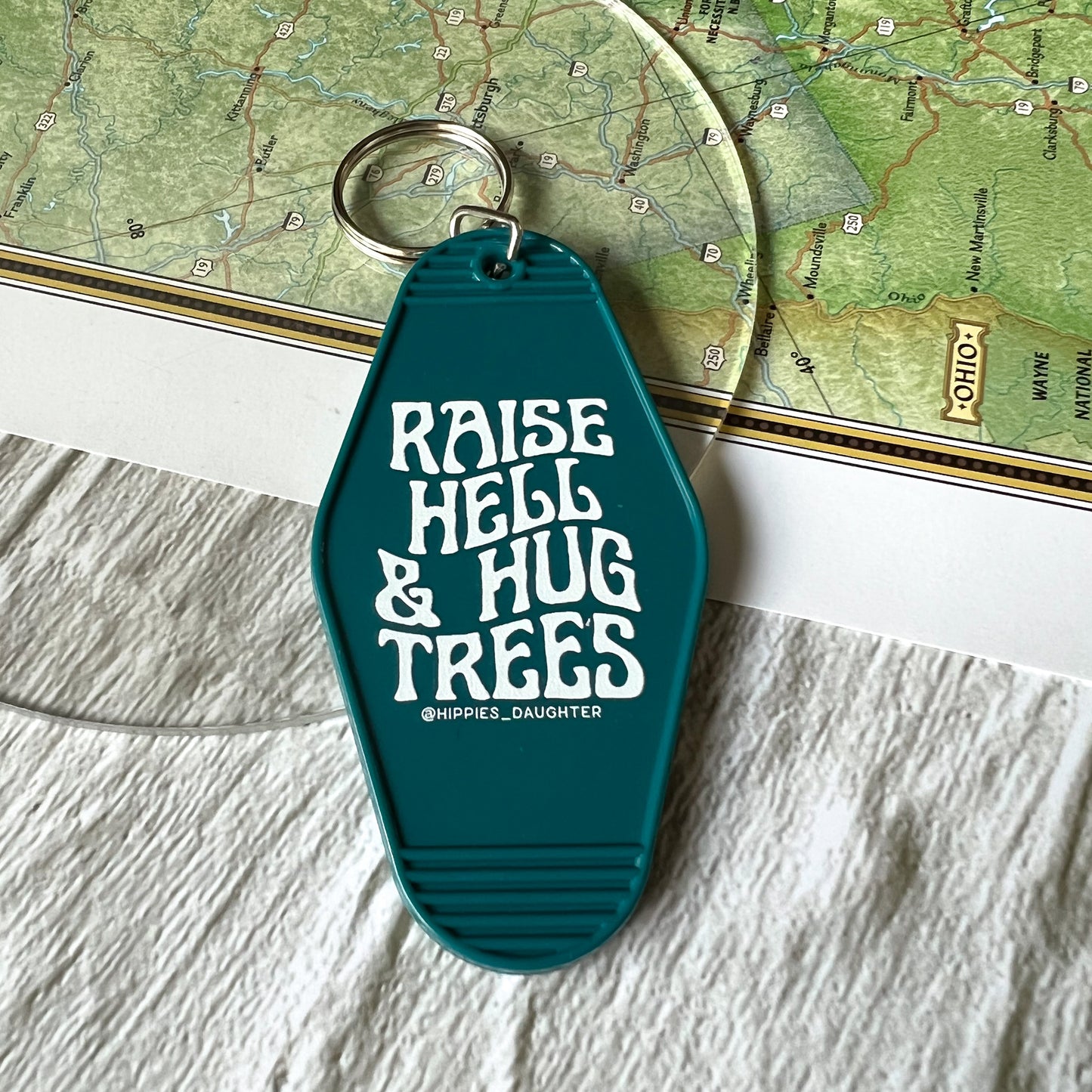 Raise hell and hug trees // motel keychain